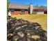Expansive backyard, features a covered patio, and brick accents on the home's exterior at 2608 Cascade Cove Dr, Buford, GA 30519