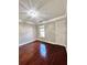 Comfortable bedroom with hardwood flooring, a window providing natural light, and neutral walls at 2608 Cascade Cove Dr, Buford, GA 30519