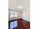 Bright bedroom with hardwood floors, large window, and neutral color scheme perfect for relaxation at 2608 Cascade Cove Dr, Buford, GA 30519