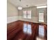 Inviting dining area with hardwood floors and elegant wainscoting at 2608 Cascade Cove Dr, Buford, GA 30519