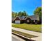 Well-manicured lawn of a cozy brick home, complete with a two-car garage at 2608 Cascade Cove Dr, Buford, GA 30519