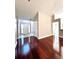 Inviting foyer with hardwood floors leading to a brightly lit front door at 2608 Cascade Cove Dr, Buford, GA 30519