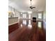 Spacious living room featuring hardwood floors, a ceiling fan, and a fireplace at 2608 Cascade Cove Dr, Buford, GA 30519