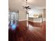 Open concept living room with hardwood floors, great natural light, and modern ceiling fan at 2608 Cascade Cove Dr, Buford, GA 30519