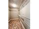 Spacious walk-in closet with ample shelving and patterned floor for organized storage at 2608 Cascade Cove Dr, Buford, GA 30519