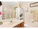 Bathroom featuring a vanity with a solid surface countertop and a decorative mirror at 4034 Brockett Walk, Tucker, GA 30084