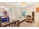 Shared bedroom with two beds, a window, and bookshelves at 4034 Brockett Walk, Tucker, GA 30084