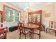 Dining room showcasing a large window, chandelier lighting, and a china cabinet at 4034 Brockett Walk, Tucker, GA 30084