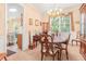 Formal dining room featuring a chandelier, a large window, and classic furniture at 4034 Brockett Walk, Tucker, GA 30084