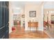 Inviting foyer with hardwood floors, a decorative table, and a view into the living room at 4034 Brockett Walk, Tucker, GA 30084