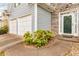Home featuring a two-car garage, and inviting entrance with a stone facade at 4034 Brockett Walk, Tucker, GA 30084
