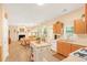 Open concept kitchen with oak cabinets, an island, and views of the breakfast nook at 4034 Brockett Walk, Tucker, GA 30084