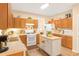 Functional kitchen with wooden cabinetry, a gas stove, and an island at 4034 Brockett Walk, Tucker, GA 30084