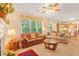 Inviting living space with plush seating, a cozy fireplace, and a sun-drenched window at 4034 Brockett Walk, Tucker, GA 30084