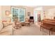 Bright living room with large window and view into the entry at 4034 Brockett Walk, Tucker, GA 30084