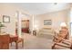 Cozy living room with carpet, a comfortable couch, and a rocking chair at 4034 Brockett Walk, Tucker, GA 30084