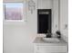 Modern bathroom featuring vanity with white countertop, a mirror, and contemporary fixtures at 611 King Arnold St, Atlanta, GA 30354