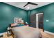 Comfortable bedroom with modern ceiling fan, stylish decor, and ensuite bathroom at 611 King Arnold St, Atlanta, GA 30354