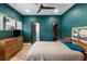 Stylish bedroom with a full-size bed, TV and contemporary decor with a ceiling fan at 611 King Arnold St, Atlanta, GA 30354