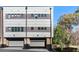 Contemporary townhome showcasing integrated garage doors and sleek architectural details at 611 King Arnold St, Atlanta, GA 30354