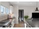 The kitchen offers stainless appliances, light countertops, and an island with a dark countertop for cooking and entertaining at 611 King Arnold St, Atlanta, GA 30354