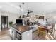 Open-concept kitchen and living area with a large island, modern lighting, and comfortable seating at 611 King Arnold St, Atlanta, GA 30354