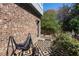 Outdoor patio with decorative ground cover and black metal hammock stand, perfect for relaxation at 611 King Arnold St, Atlanta, GA 30354