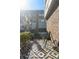 Private patio with herringbone pattern, brick siding, and open-air design. Perfect for lounging at 611 King Arnold St, Atlanta, GA 30354