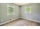 Cozy bedroom with two windows offering natural light and gorgeous wood-look flooring throughout at 1679 Hollyhock Ter, Decatur, GA 30032