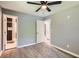 Spacious main bedroom showcasing an en suite bathroom and a ceiling fan at 1679 Hollyhock Ter, Decatur, GA 30032