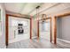 Open dining room with contemporary lighting and an open doorway to the updated kitchen at 1679 Hollyhock Ter, Decatur, GA 30032