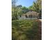 Neat and tidy home with a covered front porch and well-manicured lawn at 1679 Hollyhock Ter, Decatur, GA 30032