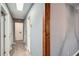 Hallway view featuring a light fixture and several doors leading to other rooms at 1679 Hollyhock Ter, Decatur, GA 30032