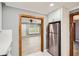 Bright kitchen with stainless steel refrigerator and doorway to a living room at 1679 Hollyhock Ter, Decatur, GA 30032