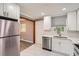 Modern kitchen with stainless steel appliances and stylish tile flooring at 1679 Hollyhock Ter, Decatur, GA 30032