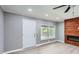 Bright living room with a fireplace and large window offering natural light at 1679 Hollyhock Ter, Decatur, GA 30032