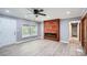 Cozy living room with modern floors, fireplace feature, and natural light at 1679 Hollyhock Ter, Decatur, GA 30032