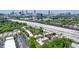 Stunning aerial view of residences with lush greenery against a vibrant Atlanta skyline backdrop at 791 Wylie Se St # 102, Atlanta, GA 30312
