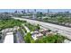 Scenic aerial view showcases residences surrounded by lush greenery against the city skyline at 791 Wylie Se St # 102, Atlanta, GA 30312