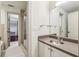 Bathroom featuring glass enclosed shower, white vanity, and access to the walk-in closet at 791 Wylie Se St # 102, Atlanta, GA 30312