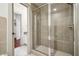 Bathroom featuring glass enclosed shower with tile surround and access to the closet at 791 Wylie Se St # 102, Atlanta, GA 30312