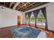 Bedroom featuring hardwood floors, large windows, exposed ceilings and a closet at 791 Wylie Se St # 102, Atlanta, GA 30312