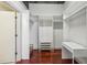 Walk-in closet features hardwood floors, built-in storage, and a desk at 791 Wylie Se St # 102, Atlanta, GA 30312