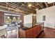 Open-concept kitchen with granite countertops, stainless steel appliances, and breakfast bar area at 791 Wylie Se St # 102, Atlanta, GA 30312