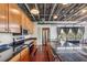 Updated kitchen featuring granite countertops, stainless appliances, and dark wood floors at 791 Wylie Se St # 102, Atlanta, GA 30312
