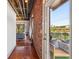 Bright living room with exposed brick, hardwood floors, and a balcony view at 791 Wylie Se St # 102, Atlanta, GA 30312