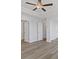 Bedroom features hardwood floors and a ceiling fan at 837 Pensive Run, Dacula, GA 30019