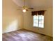 Bright bedroom featuring neutral walls, carpeted floors, and a ceiling fan for added comfort at 997 Timbervale Ln, Lithonia, GA 30058