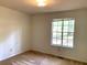 This bedroom has a window and neutral carpet at 997 Timbervale Ln, Lithonia, GA 30058