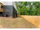 A spacious, fenced backyard offers privacy and space for outdoor activities and features basement access at 1335 Elizabeth Ave Sw, Atlanta, GA 30310